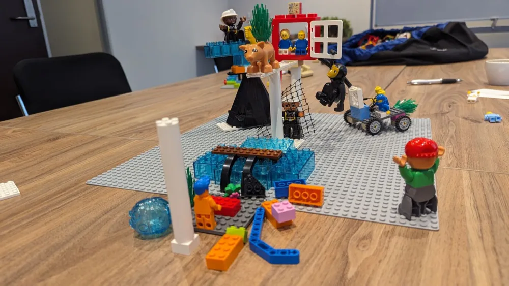 A full LEGO Serious Play scene built by a team during a workshop, covering the whole table